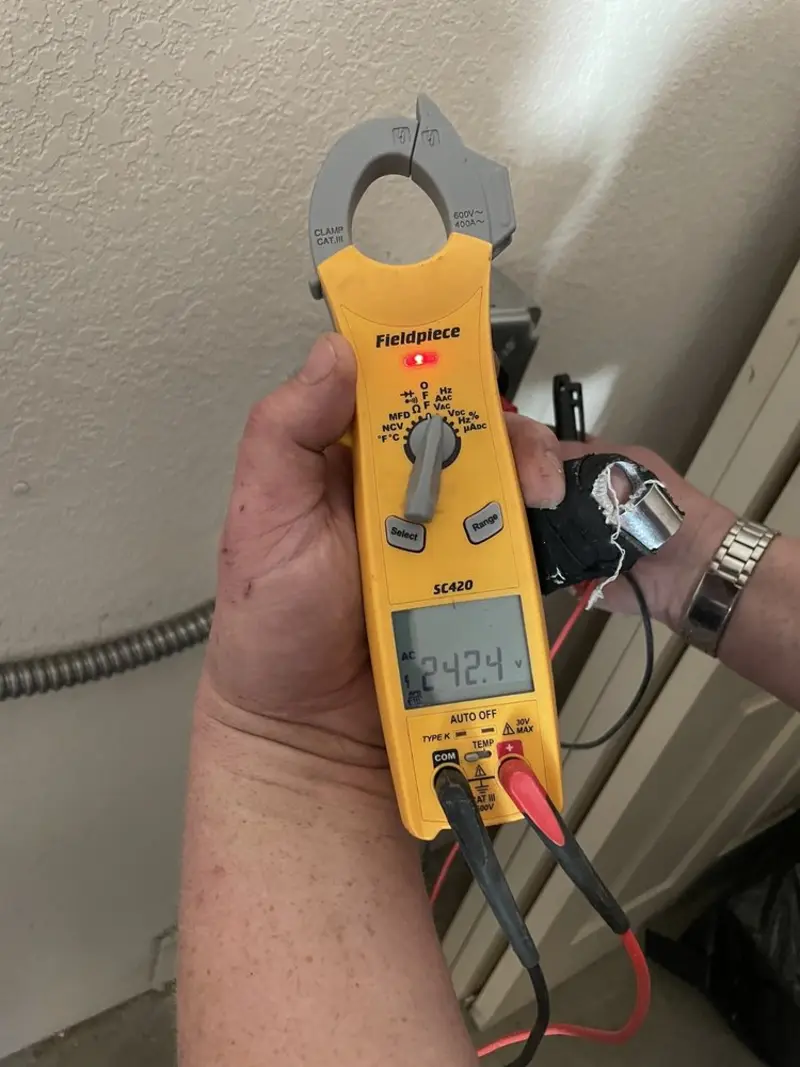 Voltage testing with clamp meter during Generator Installation in Edina